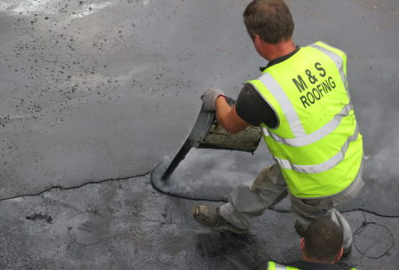 Hot tar being poured by hand on the roofs of Flesk Castle